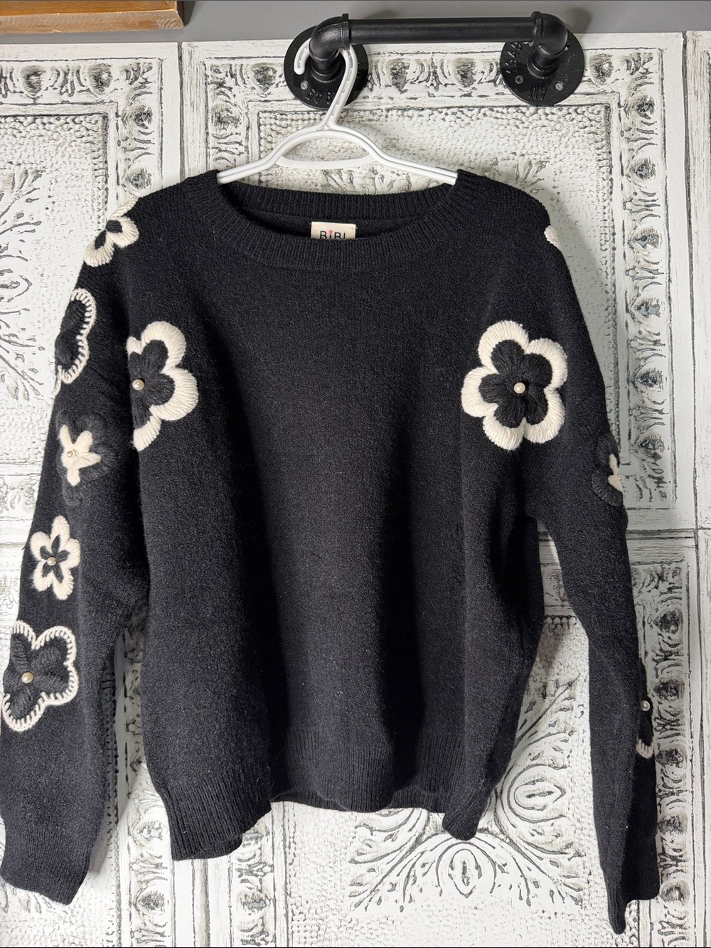 BiBi Black Crewneck Sweater with Cream Floral Appliqués